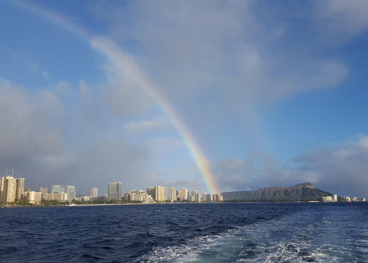 Guests relaxing on a Waikiki sunset catamaran sail